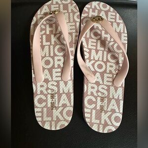41. Michael Kors Pink & White Monogram Sandals with Gold Emblem